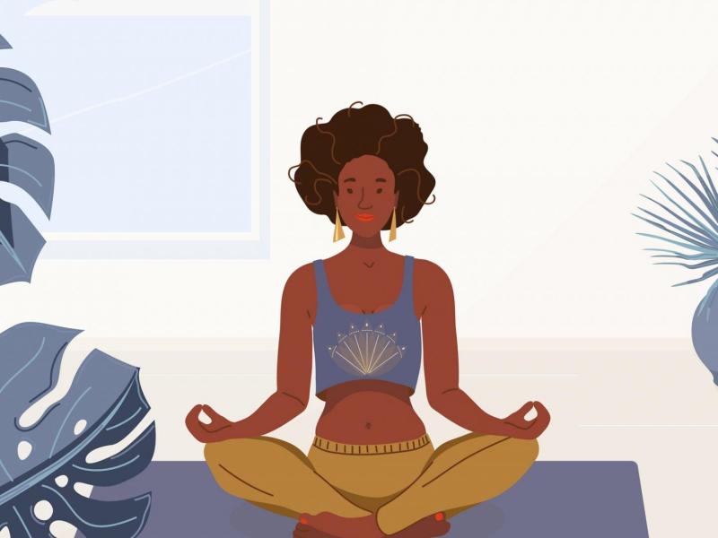 schwarze Frau macht Yoga Zuhause