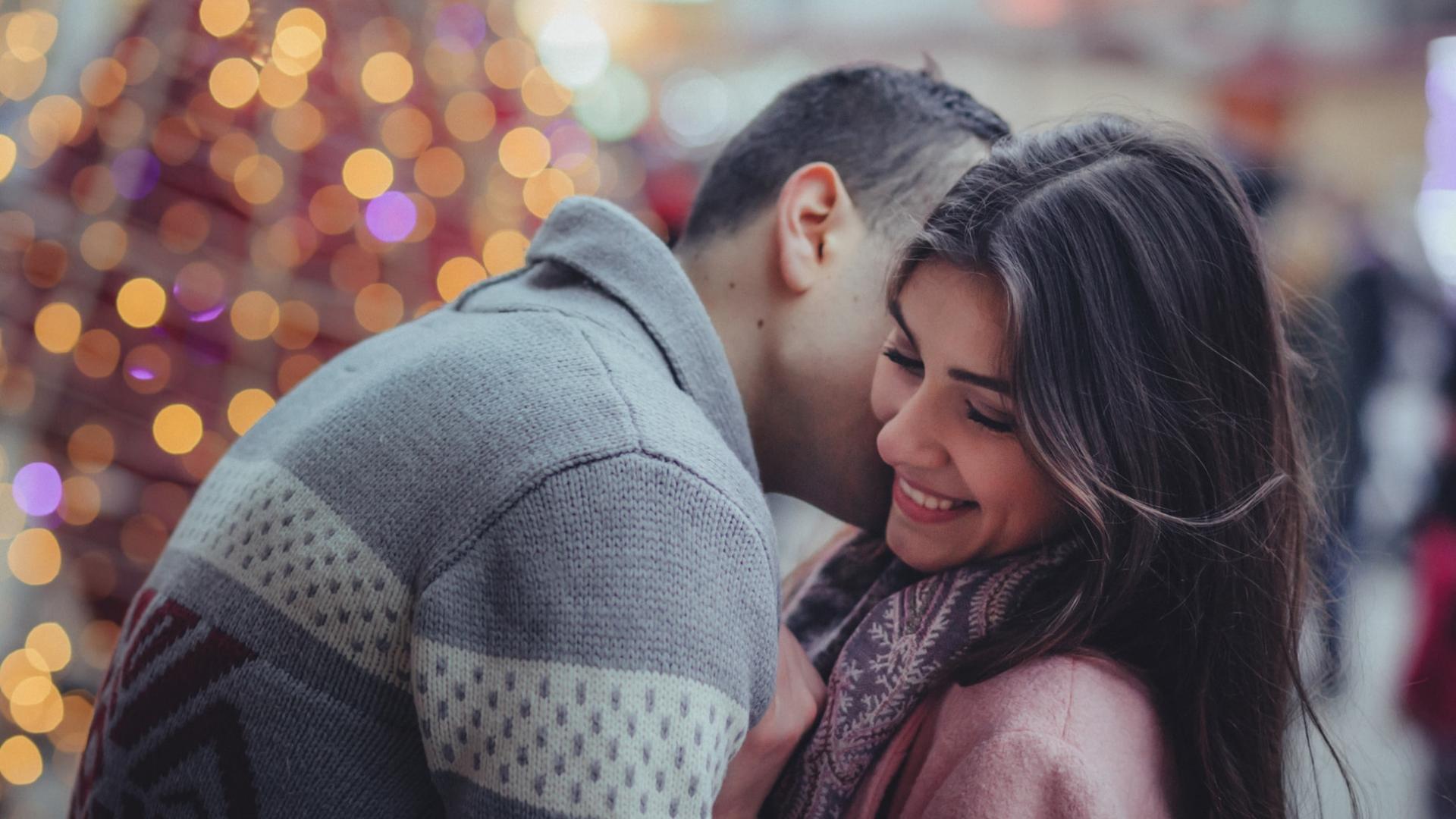 Couple kissing Christmas