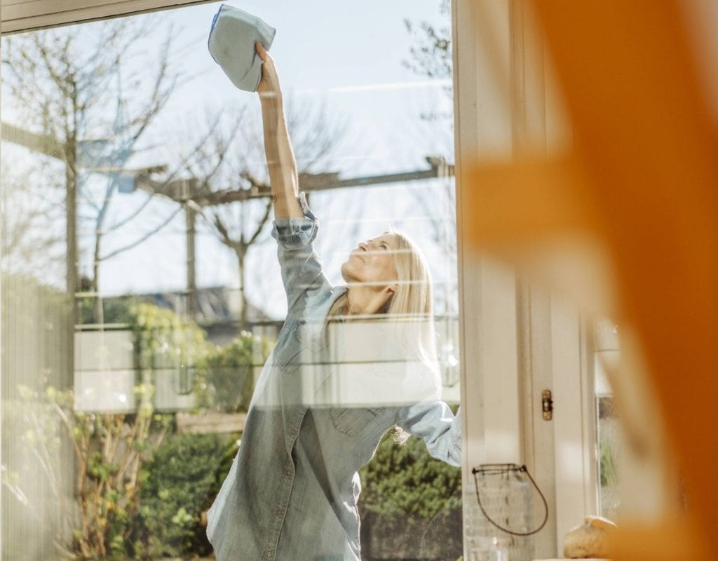 window cleaning woman outside at home clean tidy