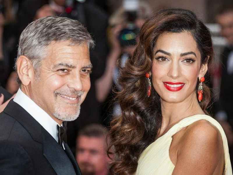 George Clooney an der Seite seiner zweiten Ehefrau Amal. © taniavolobueva/Shutterstock.com