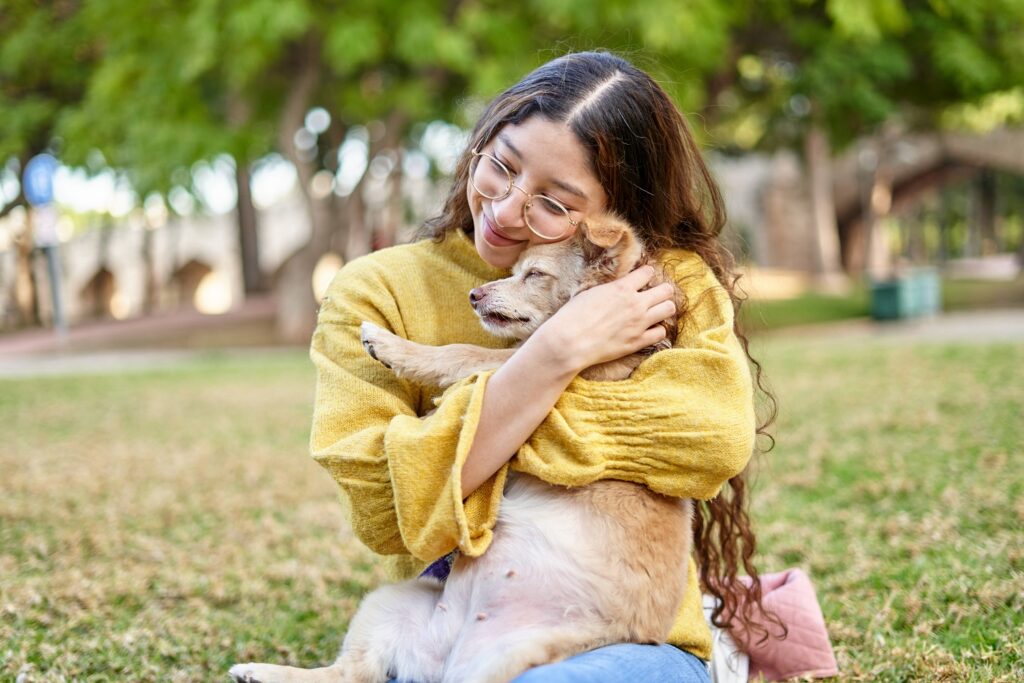 Woman hugging dog