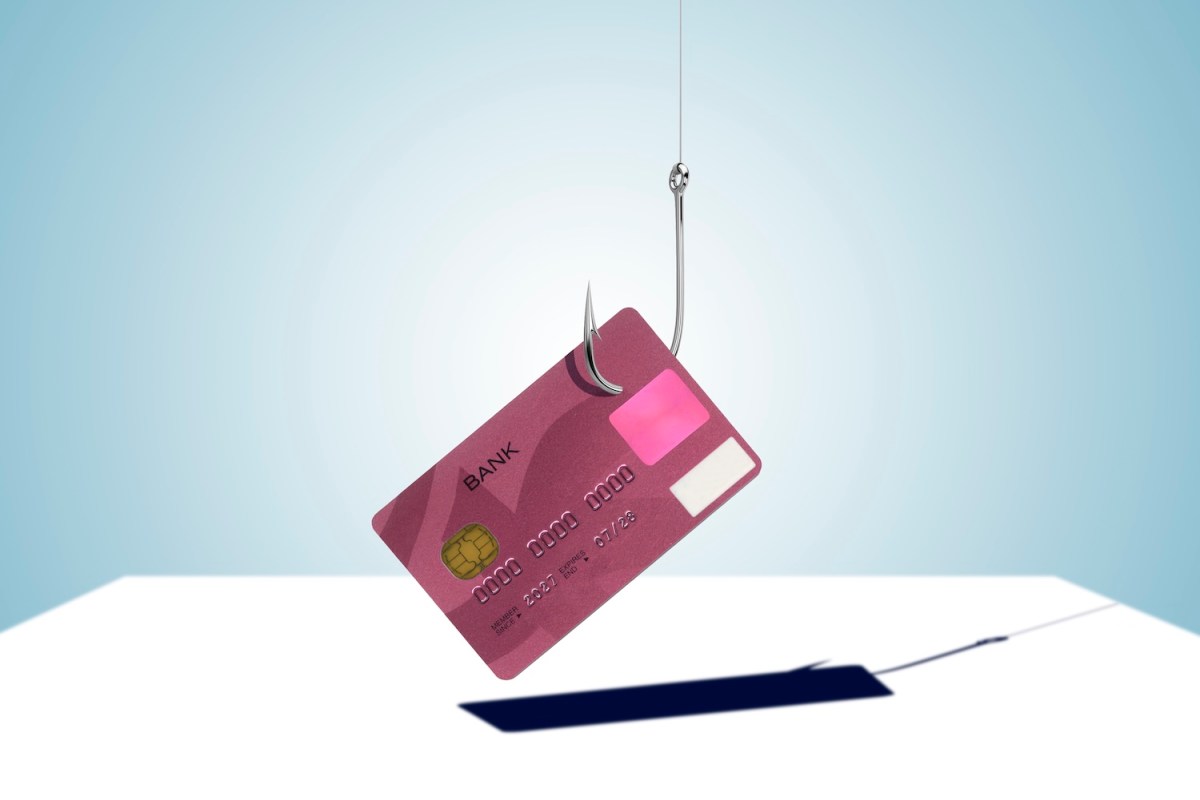 Kreditkarte ist an einem Angelhaken befestigt.