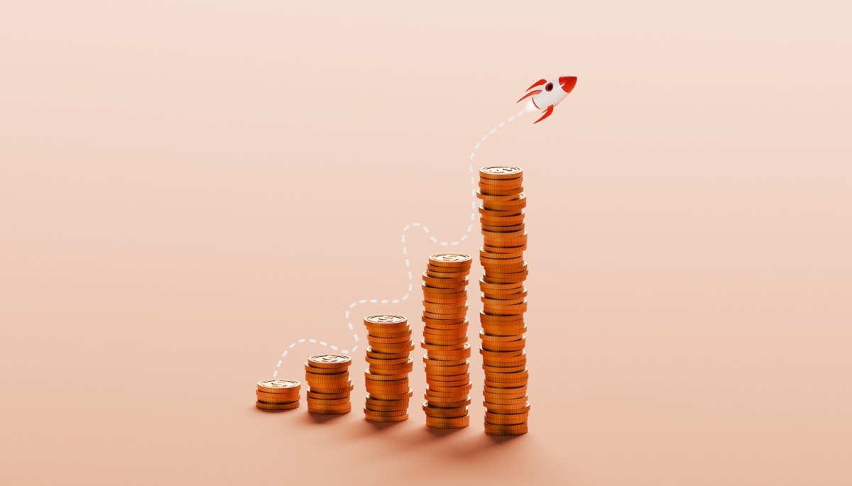 Eine konzeptionelle Illustration zeigt mehrere Stapel Silberdollar-Münzen, die in einem ansteigenden Wachstumsdiagramm angeordnet sind.